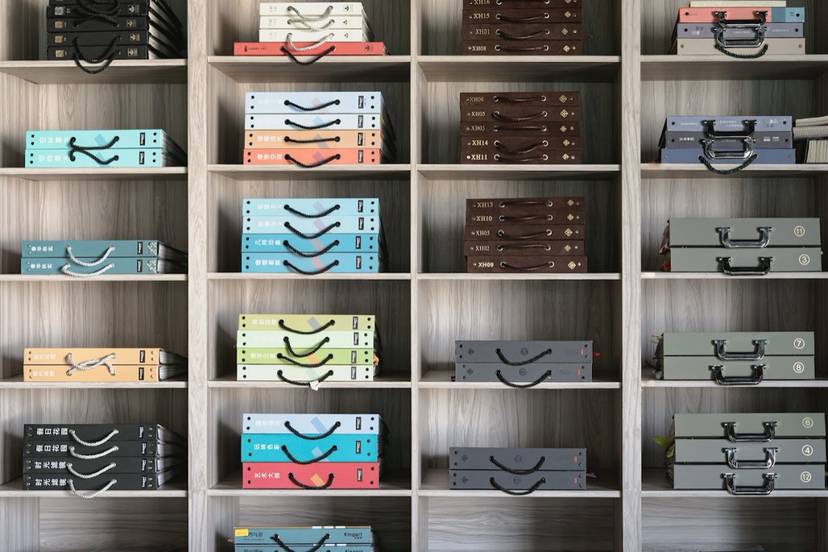 Wall of material sample boxes and swatch books